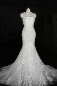 Robe de mariée longue de sirène fermeutre eclair bandouliere spaghetti textile en tulle