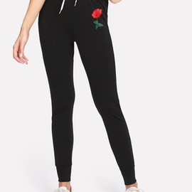 Pantalons moulant et applique de rose avec lacet