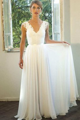 Robe de mariée facile longueur au niveau de sol decoration en fleur ligne a v encolure